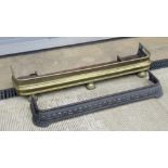 An Edwardian brass fireside fender, 14cm internal length,