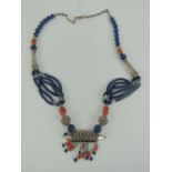 A Native American style handmade necklace having lapis lazuli, coral and turquoise beading,