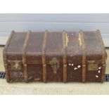 A vintage steamer trunk with leather end handles, a/f.