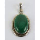 A large silver and malachite cabachon pendant, stone measuring 25 x 16mm, bale marked 925,