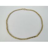 A vintage 9ct gold faceted belcher link chain necklace, indistinctly stamped 9ct to clasp,