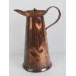 Art Nouveau: a hand made late 19th century hinge lidded copper hot water jug with riveted handle