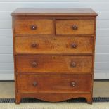 An oak chest of two short over three long drawers having shaped underskirt, side moulding deficient,