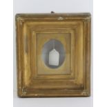 Miniature gilt frame: a deep gilt wood and gesso glazed wall hanging frame for an oval picture,