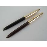 Two Hero '329' fountain pens with yellow metal nibs.