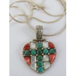 A silver heart shaped pendant set with faux coral, mother of pearl and turquoise, stamped 925,
