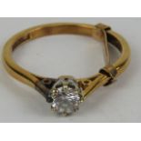 An 18ct gold, platinum and diamond solitaire ring, round cut brilliant diamond approx 0.