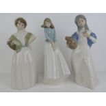 Three large Lladro type standing lady figurines, various makers, one having rose deficient.