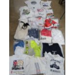 A large quantity of assorted racing and car themed clothing, a/f.