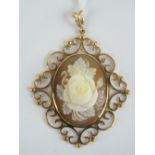 A well carved floral cameo having highly raised rose bud to centre, set in a 9ct gold mount,