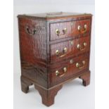 A delightful crocodile skin covered small chest of three drawers,