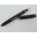 A vintage Mabie Todd 'self-filler' Blackbird fountain pen with 14ct gold Blackbird MT & Co Ltd nib.