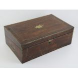 A fine quality 19th century rosewood writing slope lid lifting to reveal baise top slope having