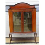 An Edwardian mahogany bow fronted display cabinet,