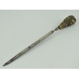 A late Victorian paper knife; cast brass dogs head handled paper knife with nickel plated blade,