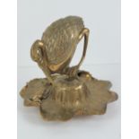 Victorian desk stand: a cast brass inkstand / standish formed as a young egret perched on a rolled