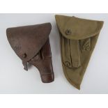 A WWII Swedish Husqvarna M07 9mm pistol holster, together with a Finish Lahti pistol holster.