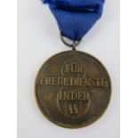 A WWII German SS 8 year service medal with ribbon.