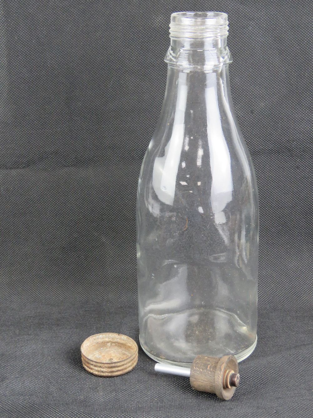 A late WWII German glass Molotov Cocktail bottle with lid (Volkssturm), 28cm high.