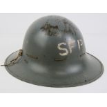 A WWII SFP Zuckermann helmet with lining and chin strap, dated 1941.