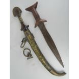 Two Eastern daggers one with brass scabbard a/f.