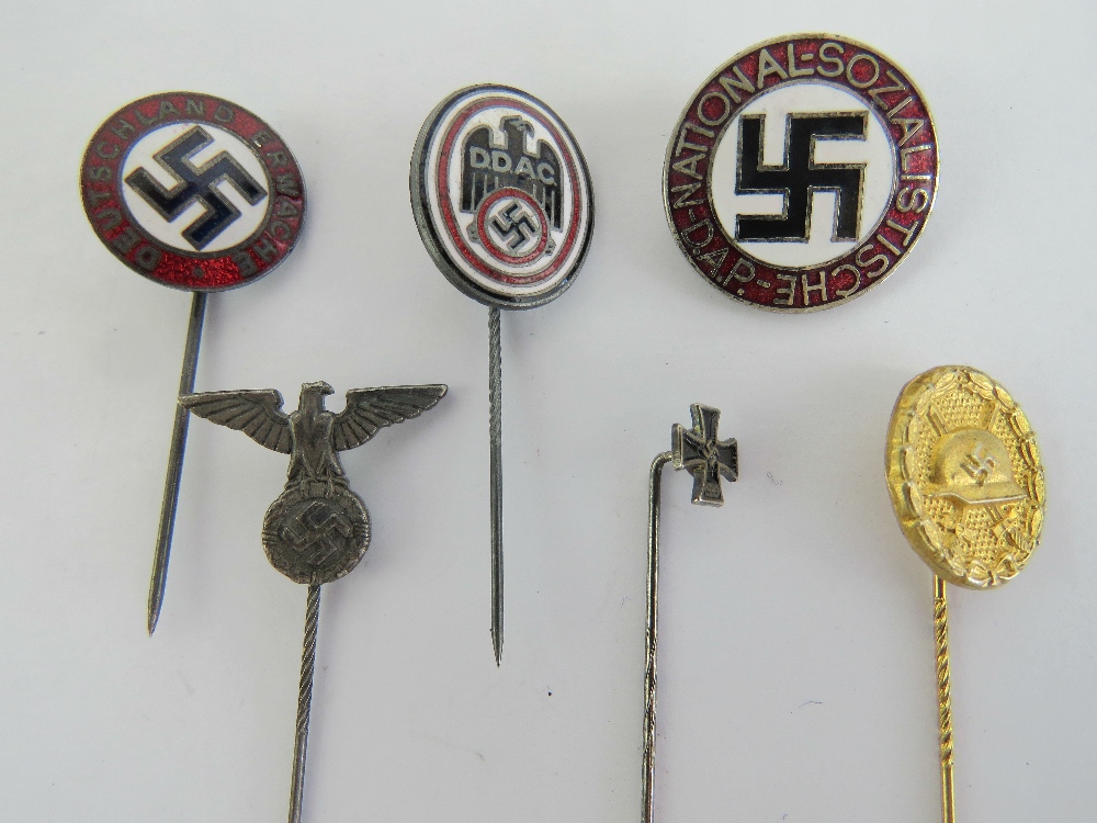 A quantity of German badges and stick pins; Iron Cross, SS, 'gold' wound, DDAC,