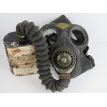 A rare WWII British gas mask by Siebe Gorman & Co Chessington Surrey, with original carry case.