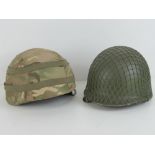 A British Army Kevlar helmet, together with a US Army steel helmet. Two items.