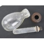 A WWII German Blendkörper chemical smoke grenade comprising glass bottle with inner glass vial,