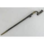 An 1853 pattern Martini Henry socket bayonet with scabbard, numbered 358 to the socket.