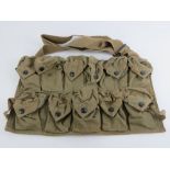 A WWII US M1 Carbine canvas magazine carrier with strap.