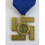 A WWII German SS 12 year service medal with ribbon.
