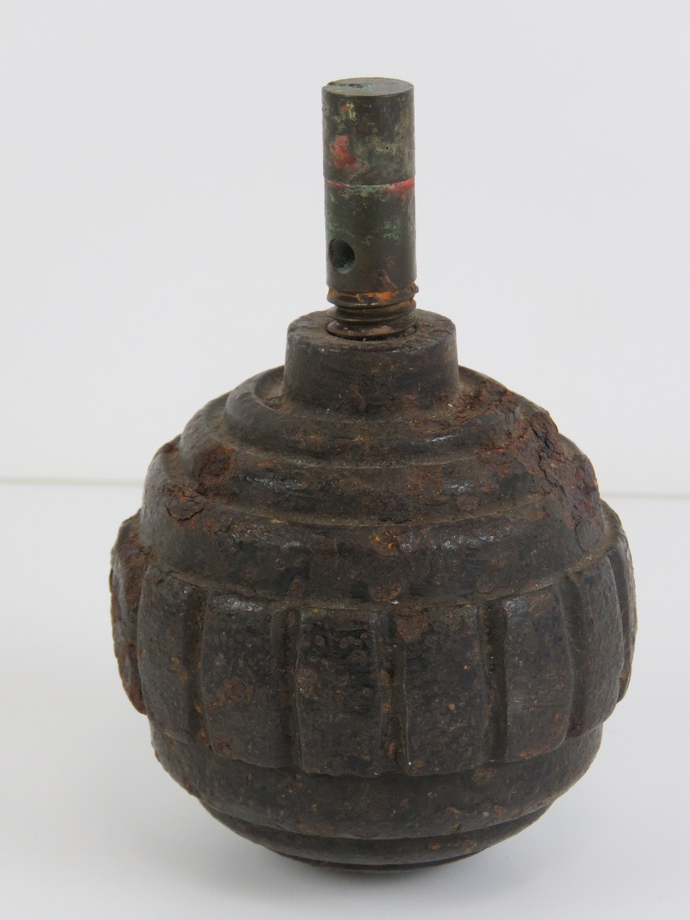 An inert WWI German Kugel grenade with fuse.