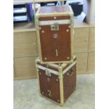 A fine pair of 'Army and Navy' style leather and velum covered military trunks each bearing