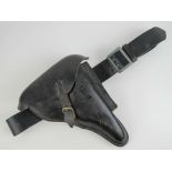 A reproduction PO8 holster with belt.