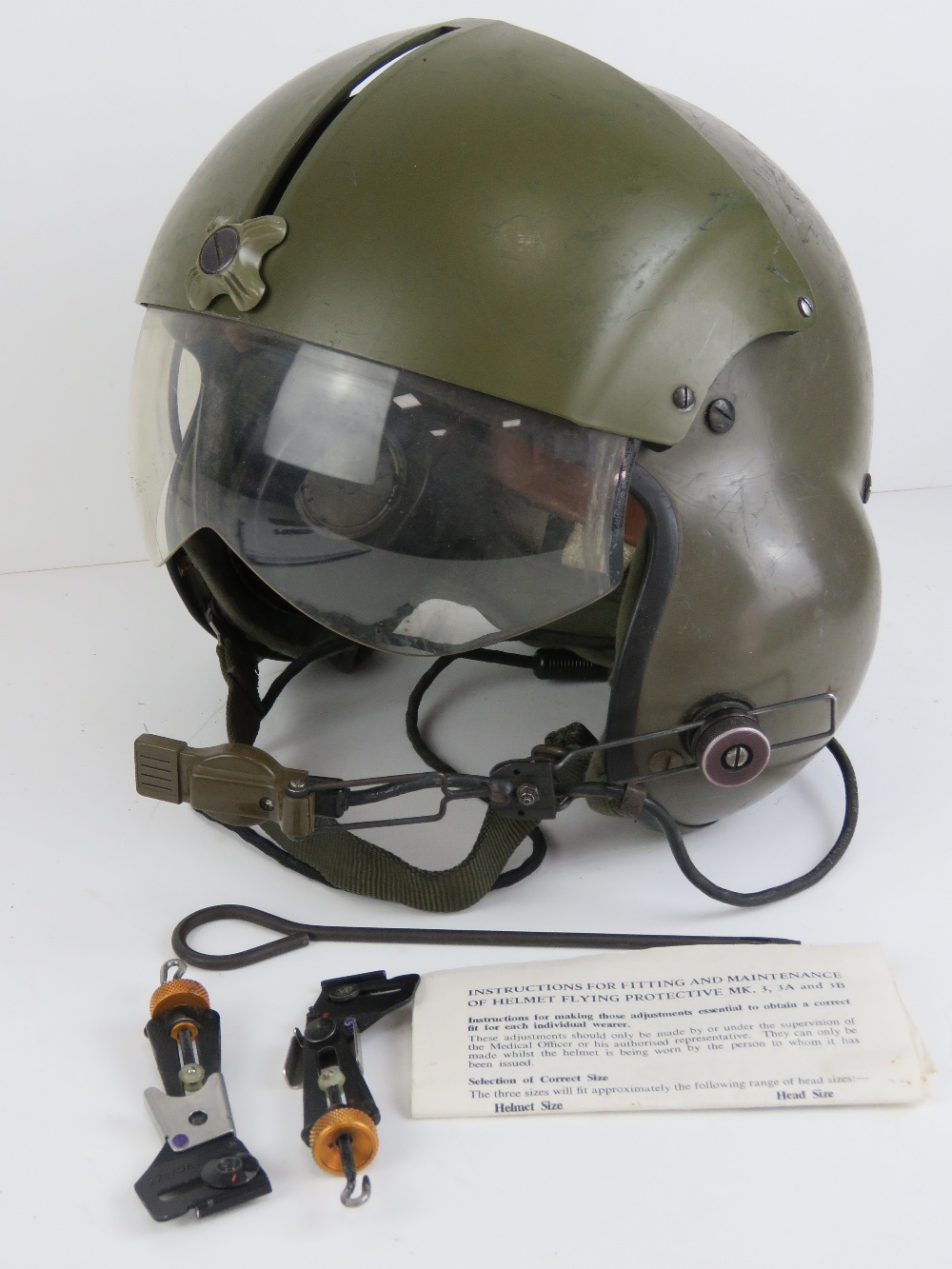 A 1971 Gentex US Pilots helmet in box with instructions.