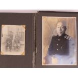 A WWII Japanese Naval Officers photograph album containing military and family portraits.