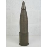 An inert WWII German 10.5cm high explosive shell with head, 52cm in length.