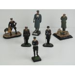Five cast metal WWII German soldier figurines together with a plaster figurine a/f. Six items.