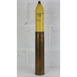An inert WWI French 75mm HE shell, re-painted, having markings on the bottom of the casing.
