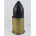 An inert WWII German 10.5cm universal AP shell with head, 30cm in length.