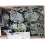 Sixteen assorted WWII German and DDR gas masks.