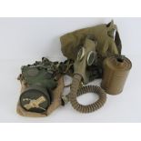 A WWII Dutch gas mask with filter and bag,