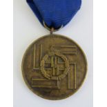 A WWII German SS 8 year service medal with ribbon.