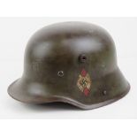 A WWI German M16 helmet with liner having later transitional Hitler Youth leaders decals upon.