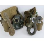 A Russian Cold War gas masks with filters and bags.