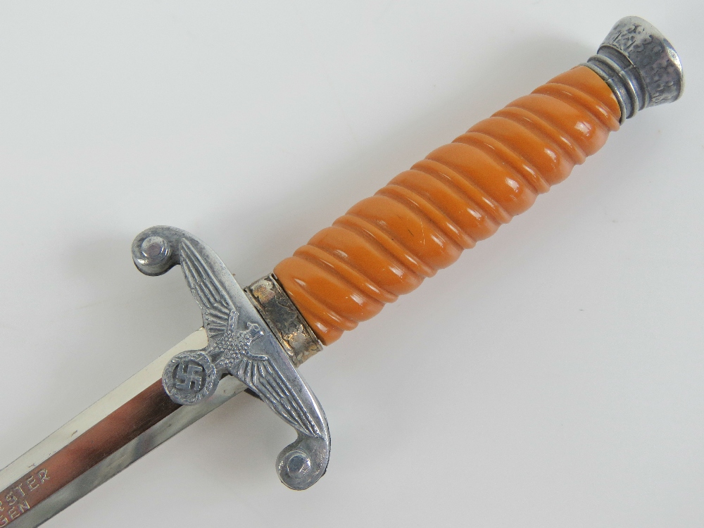 A letter opener in the form of a miniature WWII German Army dagger, marked for E&F Horster Solingen. - Image 5 of 5