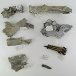 Eight crashed aircraft parts with labels of where they crashed and which part of the aircraft they