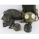 German and Hungarian Cold War gas masks with bags.