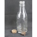 A late WWII German glass Molotov Cocktail bottle with lid (Volkssturm), 28cm high.